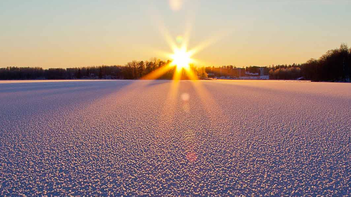 Sunrise over a field of snow