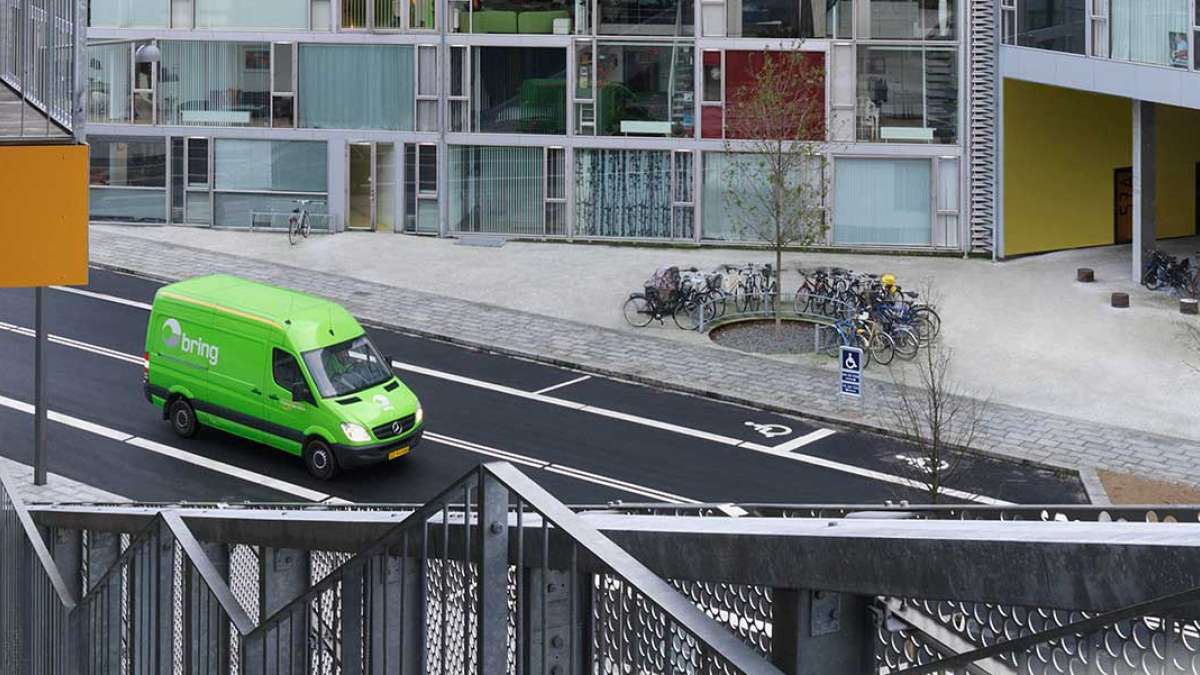 Bring van on a road in city