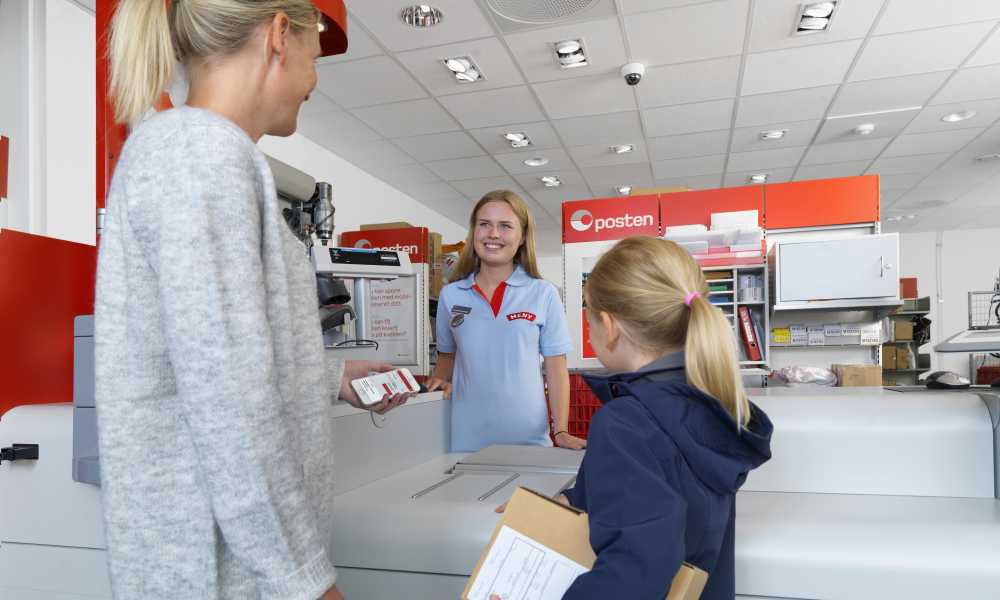 Customers picking up parcel at post office