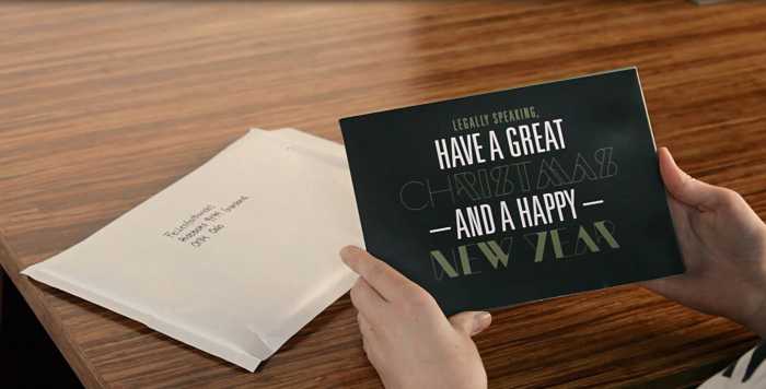 Forside av et postkort med teksten «Legally speaking, have a great christmas and a happy new year»